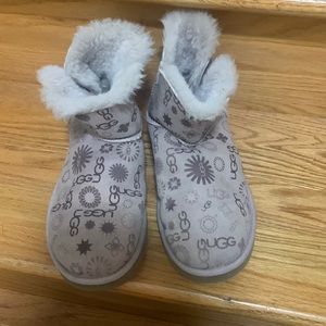 Purple UGG boots. Size 7. They say “UGG” all over them. Minimal signs of wear.